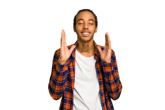 Young African American man isolated laughs out loudly keeping hand on chest.