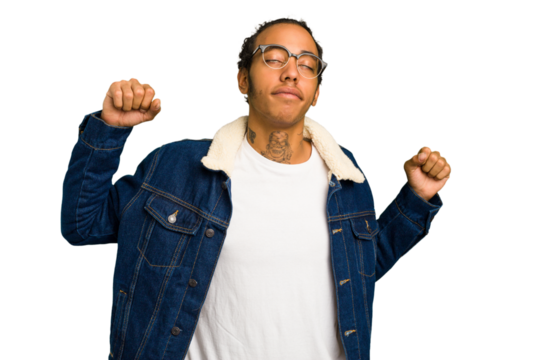 Young African American man isolated stretching arms, relaxed position.
