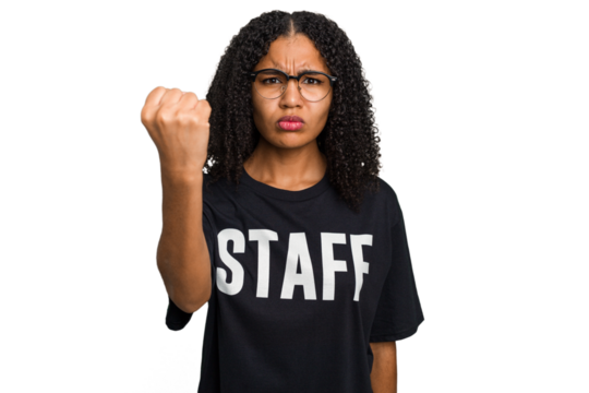 Young african american staff woman isolated showing fist to camera, aggressive facial expression. - Powered by Adobe