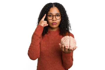 Young student african american woman holding a brain isolated pointing temple with finger, thinking, focused on a task.