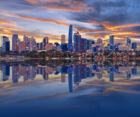 Sydney Harbour Australia at Sunset with the reflection of the Buildings and high rise offices of...