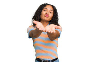 Young african american woman with curly hair cut out isolated folding lips and holding palms to send air kiss.