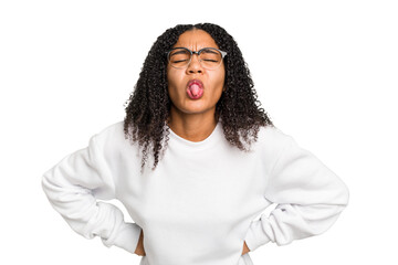 Young african american woman with curly hair cut out isolated funny and friendly sticking out tongue.