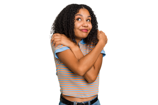 Young african american woman with curly hair cut out isolated hugs, smiling carefree and happy.