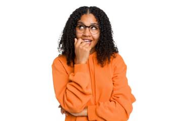 Young african american woman with curly hair cut out isolated relaxed thinking about something looking at a copy space.