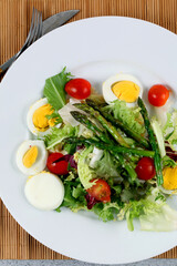 Salad plate with wild asparagus