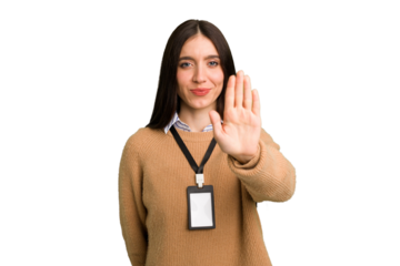 Young caucasian woman with ID card isolated standing with outstretched hand showing stop sign, preventing you.