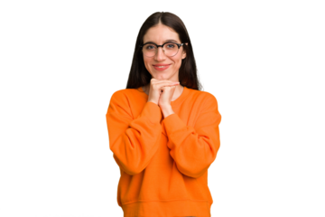 Young caucasian brunette long hair woman cutout isolated keeps hands under chin, is looking happily aside.