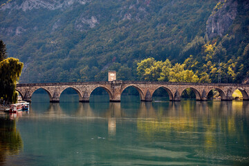Fototapeta premium Bridge on river Drina, famous historic Ottoman architecture in Visegrad, Bosnia and Herzegovina.