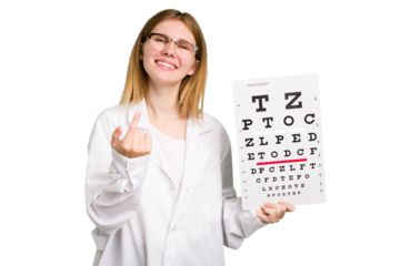 Young caucasian oculist woman holding a eye chart paper isolated pointing with finger at you as if inviting come closer.