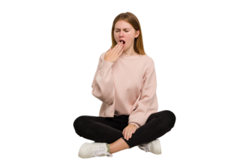 Young caucasian woman sitting on the floor cutout isolated