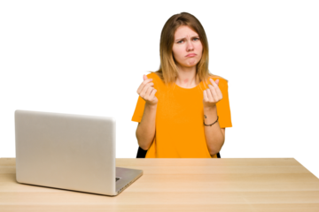 Young caucasian woman in a workplace working with a laptop isolated showing that she has no money.