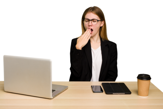 Young business caucasian woman working on her workplace cutout isolated yawning showing a tired gesture covering mouth with hand.