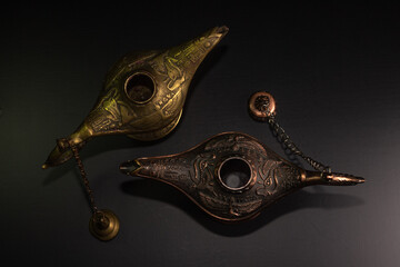 Aladdin's magic lamp isolated on black background