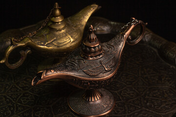 Aladdin's magic lamp isolated on black background