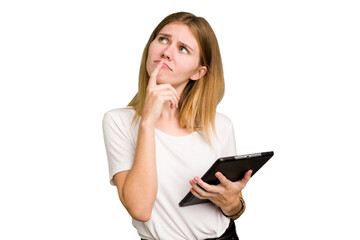 Young caucasian woman using a tablet isolated