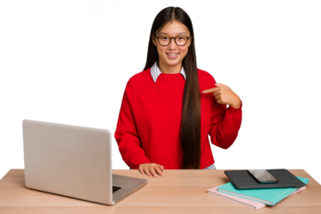 Young student asian woman in a workplace with a laptop isolated person pointing by hand to a shirt copy space, proud and confident