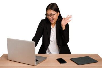 Young asian business woman working in his workplace isolated