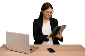 Young asian business woman working in his workplace isolated