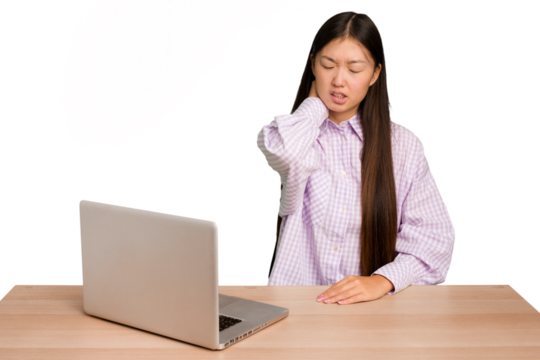 Young student asian woman in a workplace with a laptop isolated having a neck pain due to stress, massaging and touching it with hand.