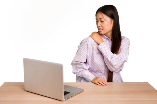 Young student asian woman in a workplace with a laptop isolated having a shoulder pain.