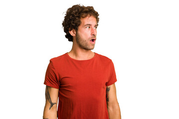 Obraz premium Young curly smart caucasian man cut out isolated being shocked because of something she has seen.