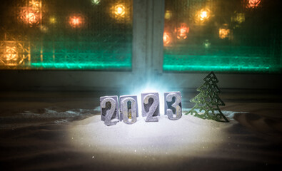 Happy New Year 2023. A frame of kitchen utensils, Christmas decorations, cinnamon, food and spruce branches on a marble background. A greeting card for Christmas. The concept of cafes and restaurants.