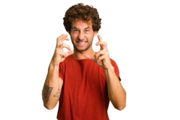 Young curly smart caucasian man cut out isolated upset screaming with tense hands.