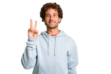 Young curly smart caucasian man cut out isolated joyful and carefree showing a peace symbol with fingers.