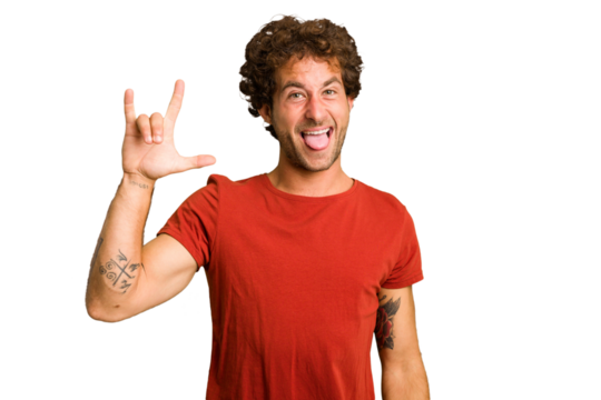 Young curly smart caucasian man cut out isolated showing a horns gesture as a revolution concept.