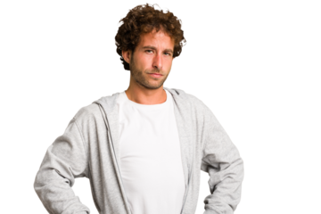 Young curly smart caucasian man cut out isolated frowning face in displeasure, keeps arms folded.