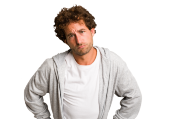 Young curly smart caucasian man cut out isolated confused, feels doubtful and unsure.