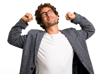 Young curly smart caucasian man cut out isolated stretching arms, relaxed position.