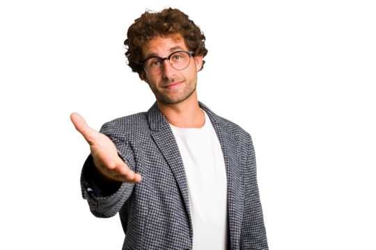 Young curly smart caucasian man cut out isolated stretching hand at camera in greeting gesture. - Powered by Adobe