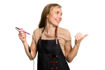Young caucasian manicurist woman holding an electric file drill isolated points with thumb finger away, laughing and carefree.