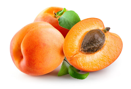 Apricot isolated. Three apricots on white background. Whole and a half of apric with clipping path. Full depth of field.