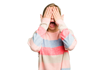 Young caucasian woman cutout isolated having fun covering half of face with palm.