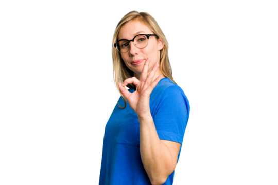 Young caucasian woman cutout isolated winks an eye and holds an okay gesture with hand.