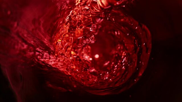 Super slow motion of pouring red wine, inside bottle view. Filmed on high speed cinema camera, 1000 fps.