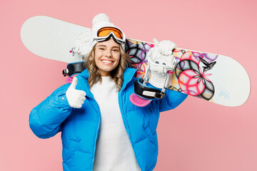 Snowboarder happy woman wear blue suit goggles mask hat ski padded jacket hold snowboard show thumb...