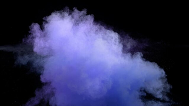 Super slow motion of colored powder collision isolated on black background. Filmed on high speed cinema camera, 1000fps. Speed ramp effect.