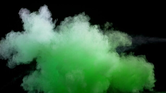 Super slow motion of colored powder collision isolated on black background. Filmed on high speed cinema camera, 1000fps. Speed ramp effect.
