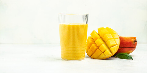 mango yogurt and fresh fruits on a light background. Long banner format