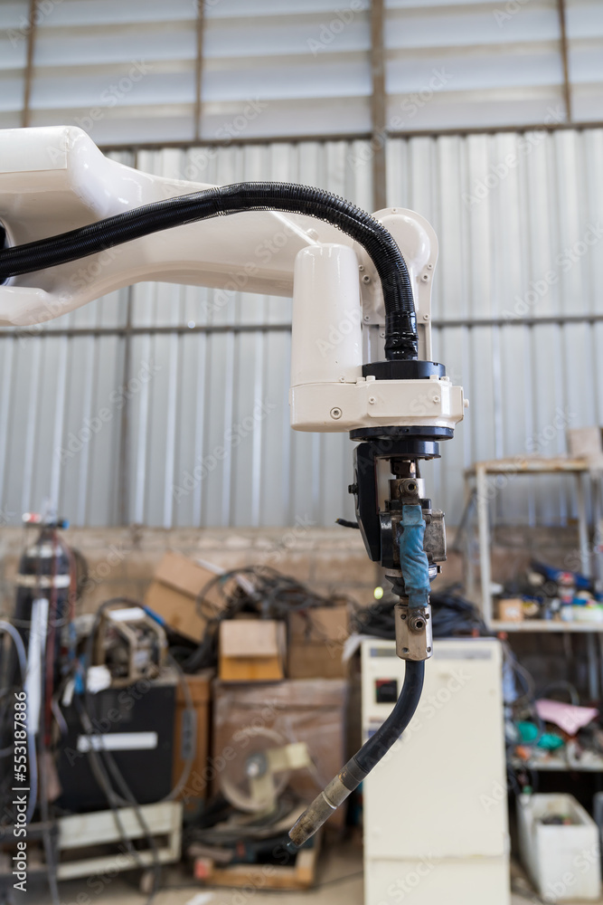 Poster close-up of automatic robot arm system welding machine in the industry factory. industry robot manuf