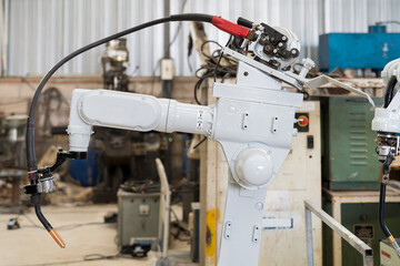 Automatic robot arm system welding machine in the industry factory. Industry robot manufacturing technology