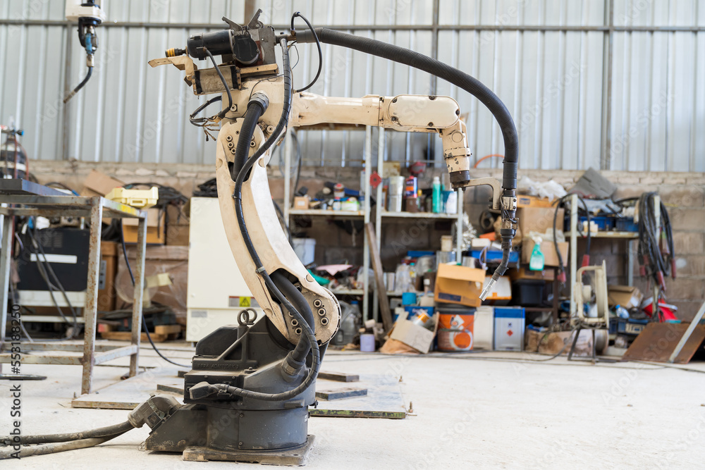 Poster automatic robot arm system welding machine in the industry factory. industry robot manufacturing tec