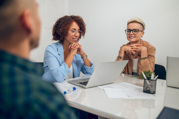 Group of office employees discussing a new project