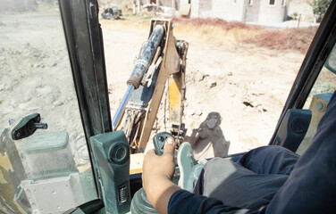 Male hand holding a control joystick. Work in excavator © andranik123