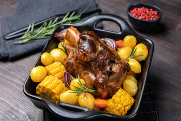 Roasted meat Pork shank knuckle with baked potatoes and corn	 - obrazy, fototapety, plakaty