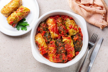 Top view of stuffed savoy cabbage with meat and rice in a tomato sauce